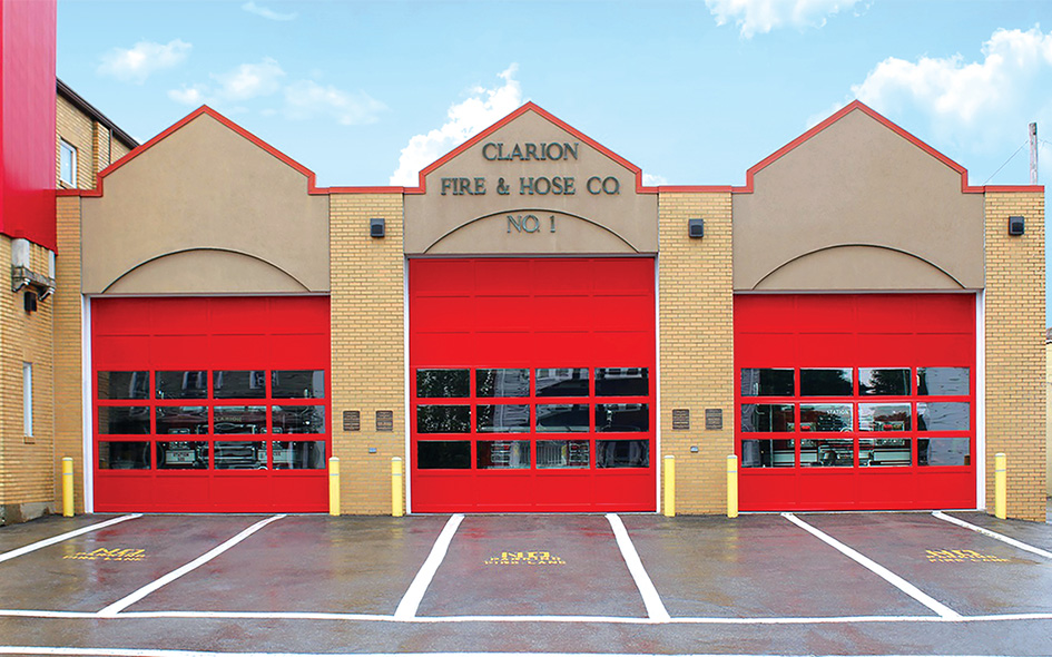 red aluminum commercial doors on fire station