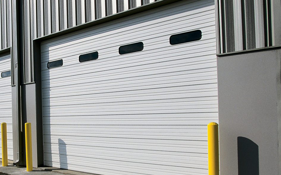 white sectional steel commercial door with windows