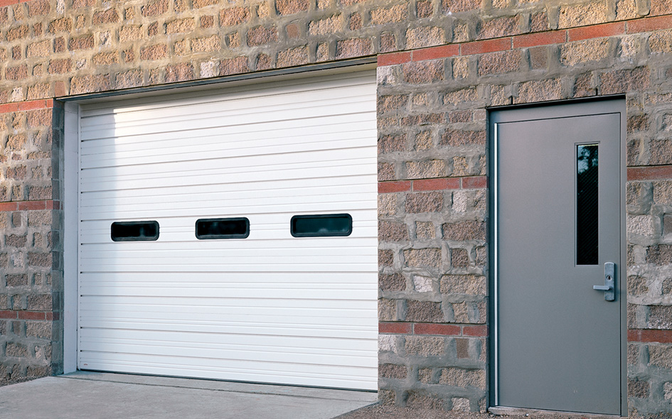 white commercial sectional steel door with three windows