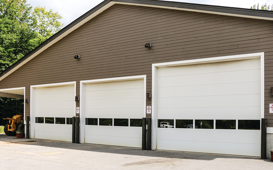 white sectional steel commercial doors with windows