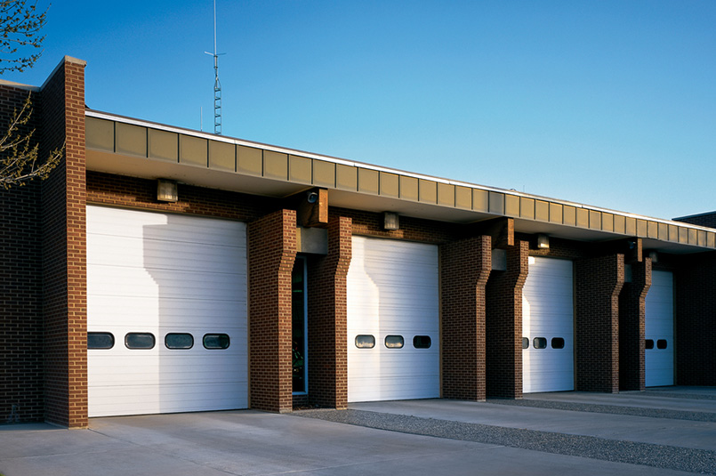 four white sectional steel commercial doors