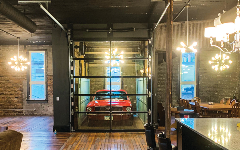 aluminum glass garage door with red car inside