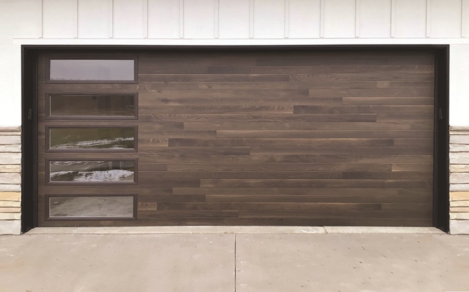medium oak colored garage door with vertical windows